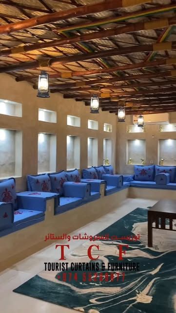 Grand majlis with carved wooden beam ceiling
